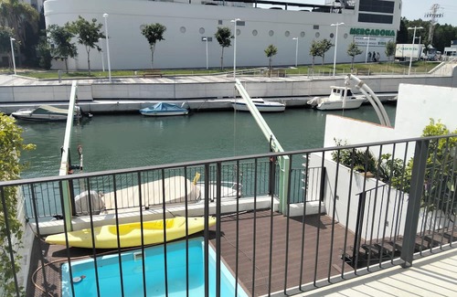 Grao de Gandia Casa | Casa con embarcadero, ideal para familias.