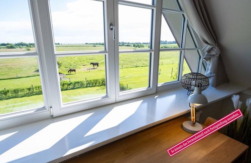 Borgsum Casa | Utblick vacation home in Borgsum: relax with a sea view and sauna