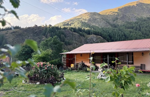 Kazbegi Casa | A Private Guest House in a secluded area by the river, surrounded by mountains.