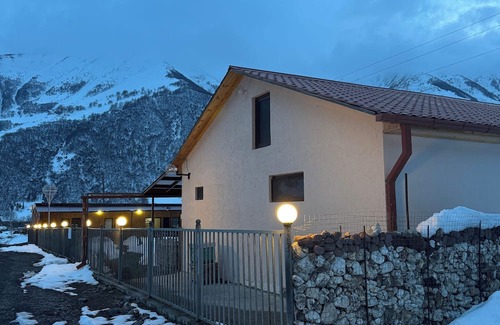 Kazbegi Casa | A Private Guest House in a secluded area by the river, surrounded by mountains.