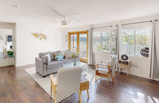 Dog-friendly lake view getaway with a full kitchen, sunroom, fireplace
