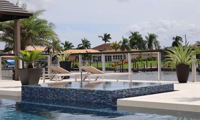 Caloosahatchee Casa | Custom Home with tile pool, boating dock and every comfort