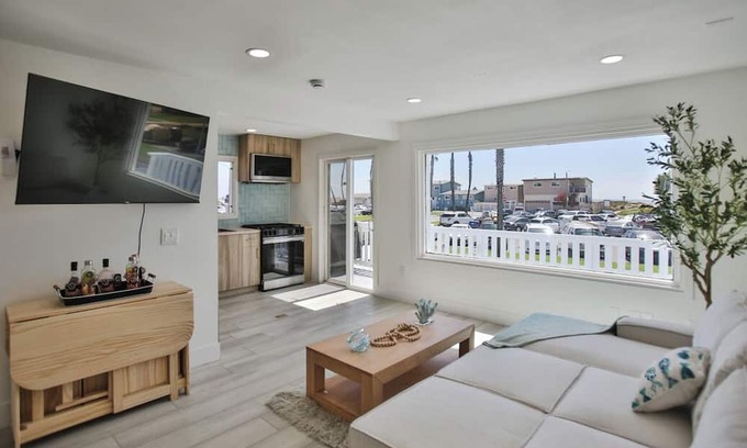 Huntington Harbour Cabaña | STEPS TO PRIVATE BEACH FRONT PANORAMIC OCEAN VIEWS! Home - parking lot - sand.