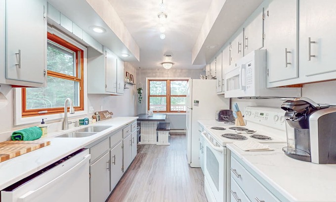 Hazelhurst Casa | Lakefront home with large patio, fire pit, air hockey & a provided peddle boat