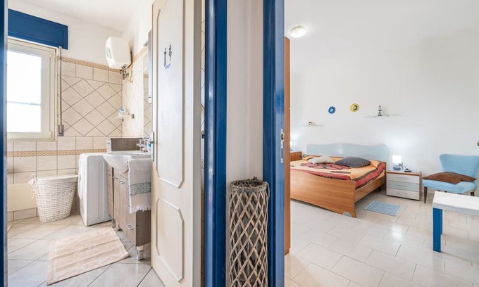 Giba Casa | Holiday Home 'La Casa Di Coccola' with Private Terrace, Wi-Fi and Air Conditioning