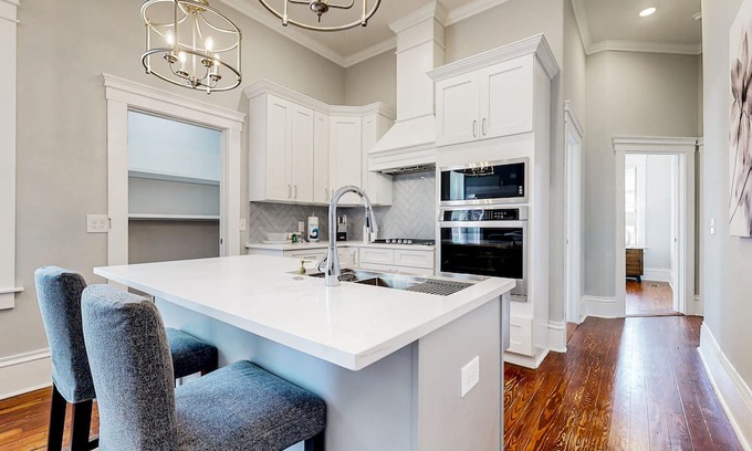 Metropolitan Casa | Dog-friendly duplex with front porch, fenced yard & walkable location