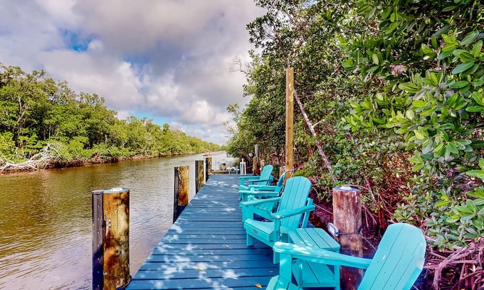 Everglades City Casa | Colorful riverfront retreat with large patio, pier, & great views - dog-friendly