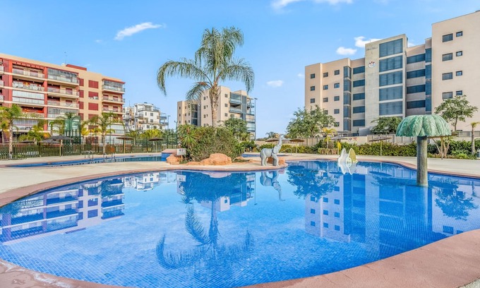 Mil Palmeras Apartamento | Apartment 'Gran Terraza Vistas Mar' with Shared Pool, Wi-Fi and Air Conditioning