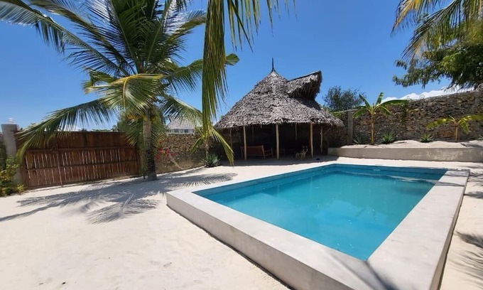 Bwejuu Beach Apartamento | SAND BEACH PALM RESIDENCE