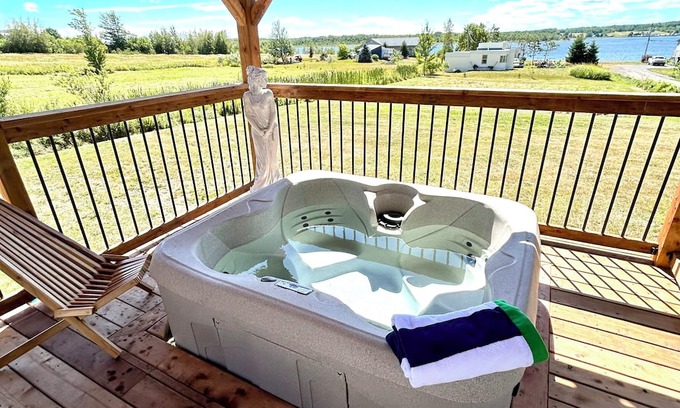 Sainte-Anne-de-Kent Cabaña | Coastal Charm Meets Country Calm | Relaxing Cottage with Water Views & Hot Tub
