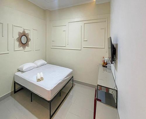 Karawang Timur Hotel | JM Tuparev Mitra RedDoorz